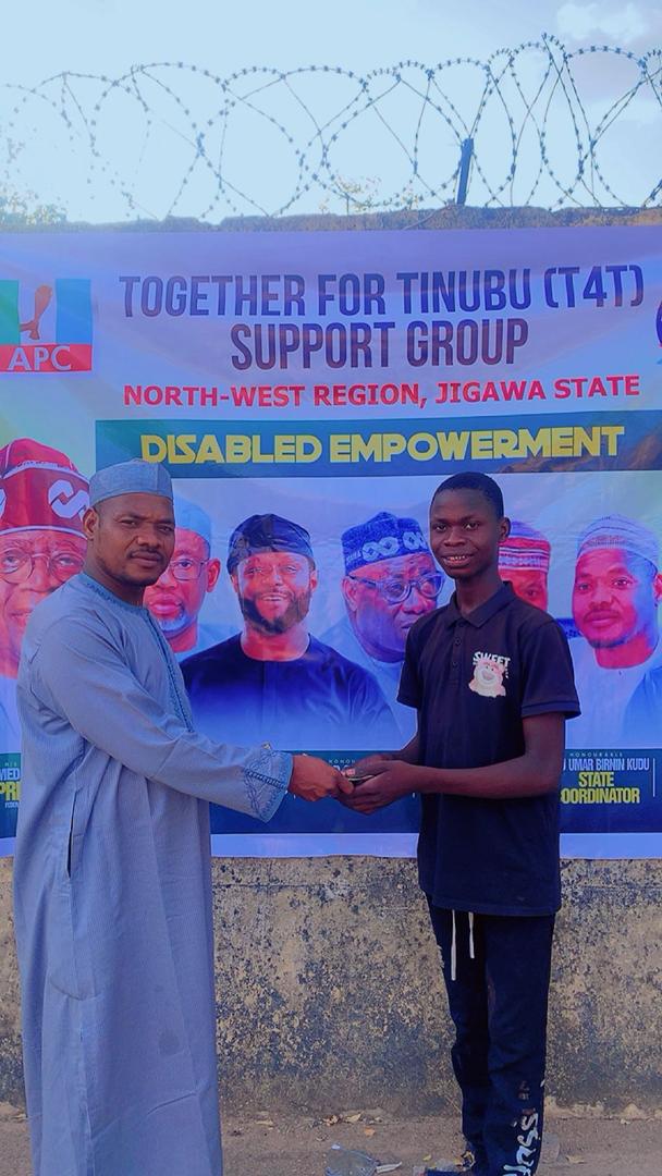 T4T State Coordinator with a young beneficiary at the Disabled Empowerment Program